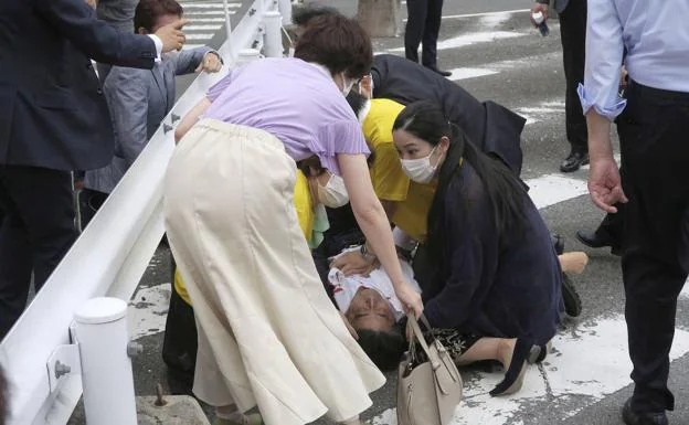 The former Japanese prime minister is treated urgently after being shot.