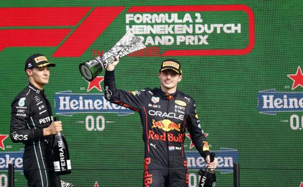 Max Verstappen celebrates his victory, with George Russel to his right.